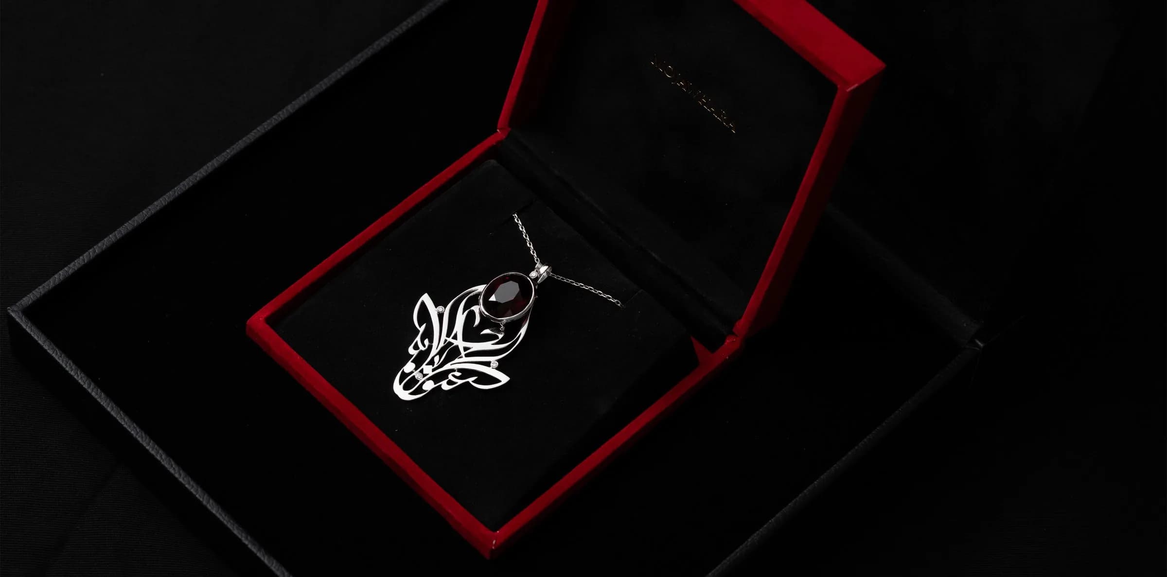 A Mojawhara creation in its presentation case, photographed open.